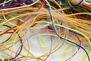 Multi-colored tangled colorful needlecraft silk thread rope. Mac