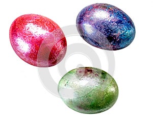 Multi-colored three marble eggs for Easter on a white background, isolate