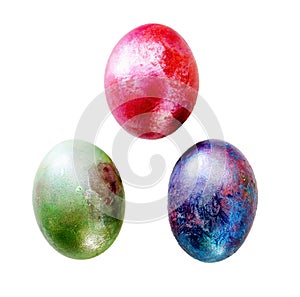 Multi-colored three marble eggs on a white background, isolate