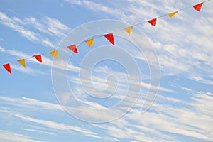Multi Colored Triangular Flags Hanging in the Sky