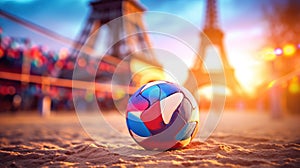 A multi-colored volleyball lies on sand against the backdrop of the Eiffel Tower during sunset, Summer Olympics in 2024