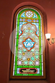 Multi-colored window stained glass inside the Jewish synagogue. Inscriptions in Polish and Hebrew