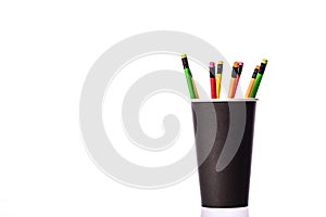 Multi colored wooden pencils with rubber eraser in black disposable paper cup