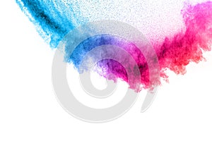 Multi colour powder explosion on white background. Launched colourful dust particles splashing photo