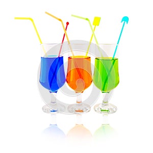 Multi-coloured cocktails in high glasses