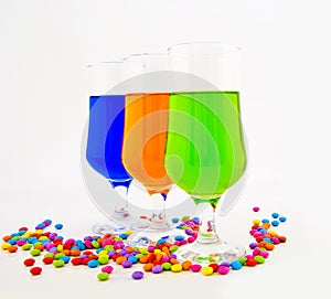 Multi-coloured cocktails in high glasses