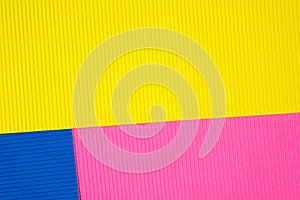 Multi coloured corrugated paper texture, use for background. vivid colour with empty space for add text or object