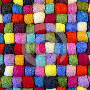 Multi coloured felt bobble table mat