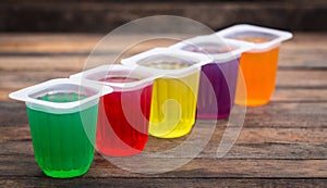 Multi Coloured fruit jelly in the plastic cups