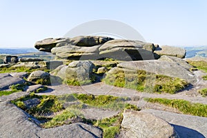 Multi-coloured gritstone boulders on Stanage Edge photo