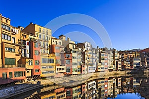 Multi-coloured houses along the River Onyar near Gomez brdge in Girona,