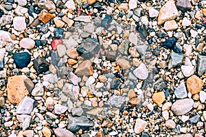 Multi-coloured sea stones gravel close-up for backgrounds