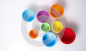 Multi-coloured stacking cups for a baby.balance concept