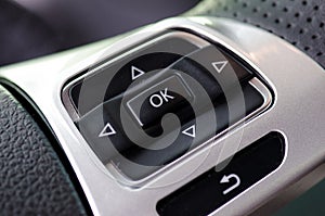 Multi control buttons on the steering wheel of the luxury modern
