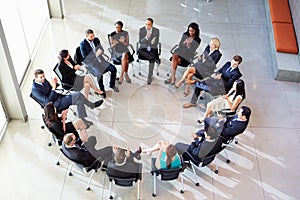 Multi-Cultural Office Staff Applauding During Meeting