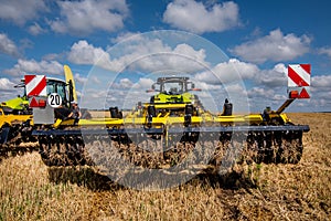 multi-disc cultivator, tillage system with tractor in field