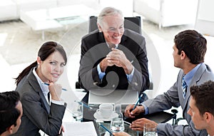 Multi-ethnic business people at a conference table