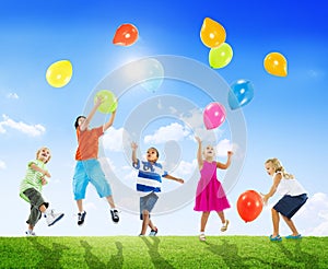 Multi-Ethnic Children Outdoors Playing Balloons