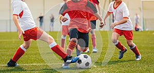 Multi-ethnic children playing soccer game