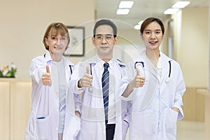 Multi-Ethnic Doctors PosÃ Â¸Â³ in the Hospital photo