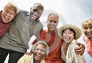 Multi ethnic Group of Friends Laughing on the beach photo