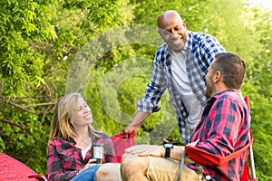 Multi-ethnic group of friends laughing and talking.