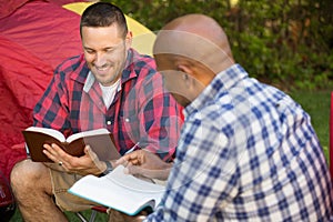 Multi-Ethnic group of friends talking and having a bible study.