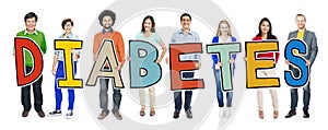 Multi-Ethnic Group of People Holding Text Diabetes