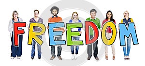 Multi-Ethnic Group of People Holding Text Freedom
