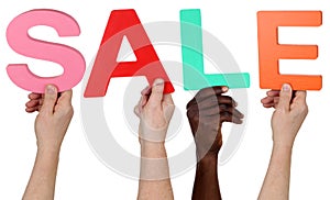 Multi ethnic group of people holding the word Sale