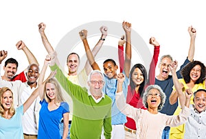 Multi-Ethnic Group Of People Raising Their Arms