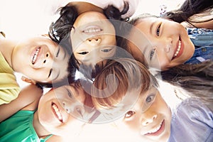 Multi-ethnic group of schoolchildren face photo