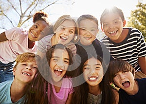 Multi-ethnic group of schoolchildren on school trip, smiling photo