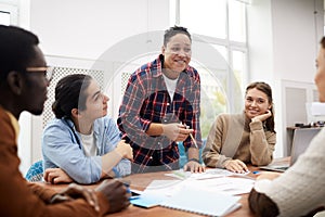 Multi-Ethnic Group of Students Discussing Project