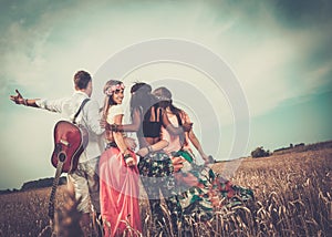 Multi-ethnic hippie friends on a road trip