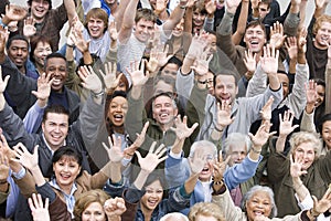 Multi Ethnic People Raising Hands Together photo