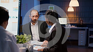 Multi ethnic teamwork entering in business office meeting room discussing company strategy