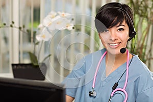 Multi-ethnic Woman Wearing Headset and Stethoscope