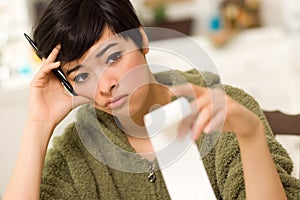 Multi-ethnic Young Woman Agonizing Over Financials photo