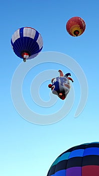 A Joker-Faced Balloon Floating Above the Fiesta