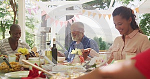 Multi-generation African American family spending time in garden together