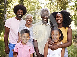 Multi generation black family in a forest, close up portrait