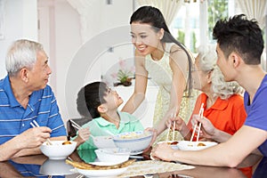 Multi-Generation Chinese Family Eating Meal