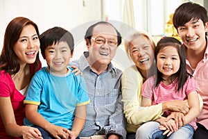 Multi-Generation Chinese Family Relaxing At Home