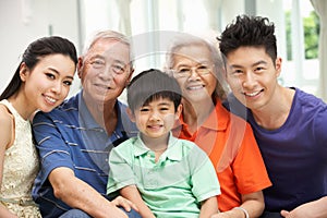 Multi-Generation Chinese Family Relaxing At Home