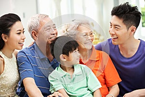 Multi-Generation Chinese Family Relaxing At Home