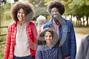 Multi Generation Family On Autumn Walk In Countryside Together