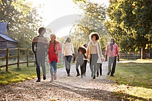 Multi Generation Family On Autumn Walk In Countryside Together