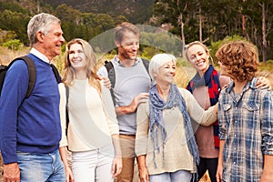 Multi-generation family bonding with each other in a forest