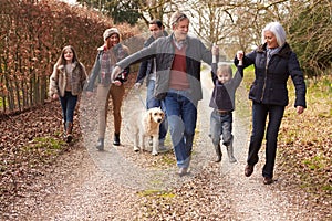 Multi Generation Family On Countryside Walk